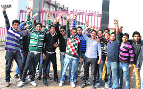 Students of the Doon Valley Institute of Engineering protest against a wide fluctuation in their fees and delay in release of roll numbers in Karnal on Friday.