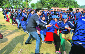 Employees of Sukam participate in a tug of war contest during a sports meet in Gurgaon.