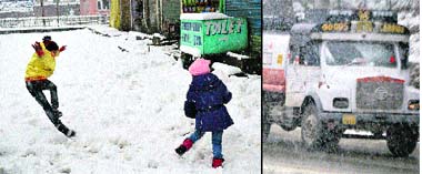 Children revel in the snow; (right) an oil tanker stranded near Qazigund, some 65 kilometres from Srinagar, on Friday. 