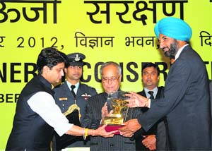 President Pranab Mukherjee presents National Energy Conservation Award to Punjab Director-General of School Education KS Pannu in New Delhi on Friday. The award was given for creating awareness about energy conservation among students. Union Minister Jyotiraditya Scindia is also seen
