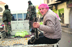 Syrian rebel fighters head south of the northern town of Darkush on Friday.