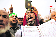 A supporter of Muhamed Mursi and the Muslim Brotherhood at a rally in Cairo on Friday.