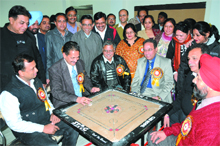 DGM SP Shrimali tries his hand at carrom on the first day of the sports meet in Bathinda on Saturday. 