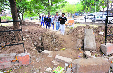 The dug up entrance of the green belt in Sector 41 in Chandigarh on Saturday.