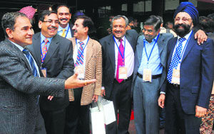Alumni share a light moment during the PGI Golden Jubilee Alumni Convention in Chandigarh on Saturday.