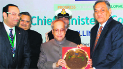 Chief Minister Vijay Bahuguna receives the Best State Award for Uttarakhand from President Pranab Mukherjee at a function in New Delhi on Saturday.