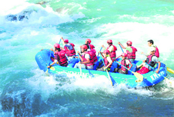 Sailing on rough waves: Rafting enthusiasts raft in the Sharda river in Kumaon. Photo by BD Kasniyal