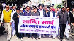 Members of the Punjabi, Agarwal and Brahmin communities take out a procession against reservation at Tohana in Fatehabad district on Saturday