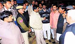 Deputy commissioner J Ganesan interacts with villagers at Madhosinghana in Sirsa on Friday night