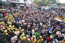 The police stops government employees from marching towards Raj Bhawan inJammu on Saturday.