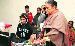 An applicant for Aadhar card gives her fingerprints at a centre in Jalandhar on Saturday