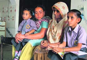 Harpreet Kaur of Gaunspur village (second from left), who has lost seven members of her family to water-borne diseases