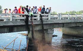 Microbes being introduced into the nullah near Jainpur village
