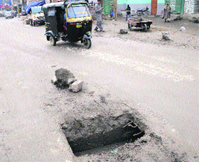  An open sewerage manhole at the main market, Batmaloo, Srinagar, that could cause a serious accident. 