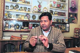 HIS Fathers son Sunil Bansal, son of the late Hazari Lal Bansal, carries on his fathers legacy. In the background are trophies awarded to his father
