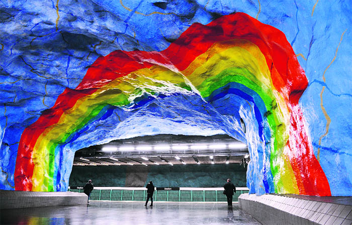 People walk at the Stadion subway station in Stockholm.