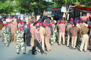 Cops keep a watchful eye on the protesters to ensure peace is maintained in the city.