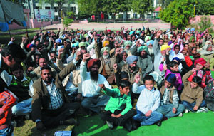 Members of the Unemployed Linesmens Union, supported by their family members, gather at the Nehru Park to protest in favour of their pending demands.