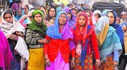 The grieving family members of the victims at the Sector 25 colony in Chandigarh on Sunday. 
