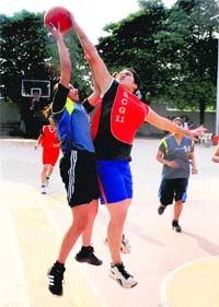 Players during a match of the Senior State Basketball Championship at New Public School, Sector 18, in Chandigarh on Sunday