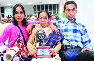 Asha Manwani with her children after receiving the Neerja Bhanot Award at the UT Guest House in Chandigarh on Sunday.