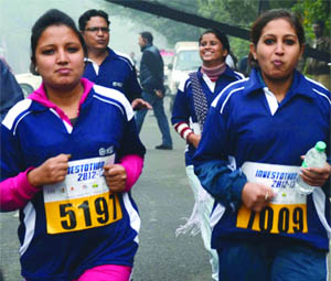 Runners participate in Investothon-2012, organised by the National Stock Exchange at Thyagraj Stadium in New Delhi on Sunday.
