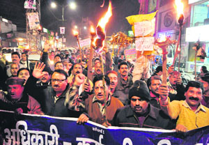 UP IN ARMS: State government employees hold a protest against quota in promotions in Dehradun on Sunday.