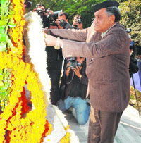 Chief Minister Vijay Bahuguna pays floral tributes at the martyrs memorial in Dehradun on Sunday.