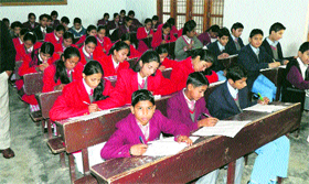 Students take a multiple-choice question test in Kangra on Sunday.
