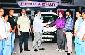 Members of the UK-based HPD Welfare Society hand over the keys of an ambulance to Col BS Multani (retd), administrator of Pingla Ghar, in Jalandhar. 
