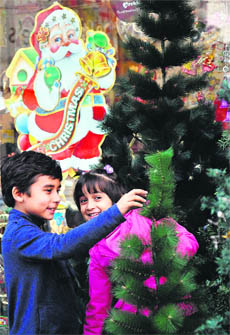 Children shop for Christmas in Jalandhar on Sunday.