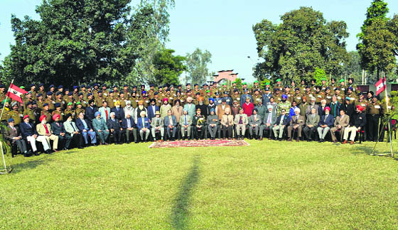 Serving and retired Army officers and jawans pose for a group photograph near War Memorial in Jalandhar Cantonment on Sunday. 