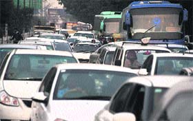 Motorists caught in a heavy traffic jam resulting from the Lord Jagannath rath yatra in Ludhiana on Sunday