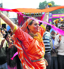 A foreigner takes part in Lord Jagannath Rath Yatra in Ludhiana on Sunday.