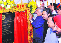 Union Railway Minister Pawan Kumar Bansal lays the foundation stone of an overbridge at a level crossing on the Sangrur-Barnala highway in Sangrur on Sunday.
