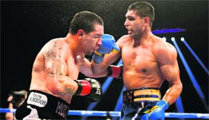 Britains Amir Khan (R) lands a punch on Carlos Molina of Norwalk at the Los Angeles Sports Arena on Sunday. 