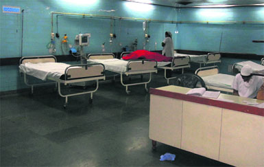 A ward wears a deserted look owing to power cuts at Guru Nanak Dev Hospital in Amritsar on Monday.