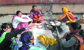 Special trainer teachers prepare rotis and subzi at the dharna site to keep their body and soul together while carrying out their protest in Bathinda.