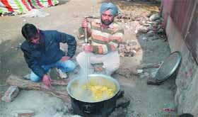 Special trainer teachers prepare rotis and subzi at the dharna site to keep their body and soul together while carrying out their protest in Bathinda.