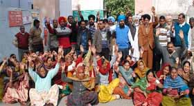 members of the Lok Jan Shakti Party protest outside the Municipal Corporation office in Bathinda on Monday. 