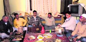 Members of the Holi mandal sing songs as part of the Baithaki Holi in Nainital.