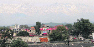 A view of the snow-clad Dhauladhars in Kangra on Monday. 