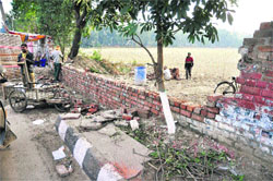 Work under way on a boundary wall at the Government College for Girls in Ludhina.