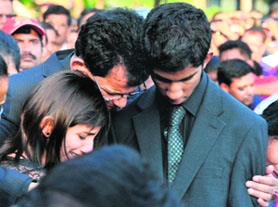 Jacintha Saldanhas daughter, husband and son at her funeral near Mangalore on Monday.