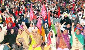 Activists of various labour unions hold a protest in Jalandhar on Monday.