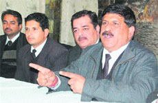 Pardeep Kumar Saini (right), president, Bar Association, addresses media in Amritsar on Tuesday.