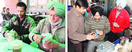 Members of the Health Department team collect and check samples of food items at GNDU canteens in Amritar on Tuesday.