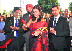 Bollywood actress Lisa Ray inaugurates LifeCell International service at Manesar, Gurgaon, on Tuesday. Tribune photo: Sayeed Ahmed