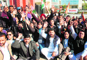 Members of the Youth Congress hold a protest in Jammu on Tuesday.