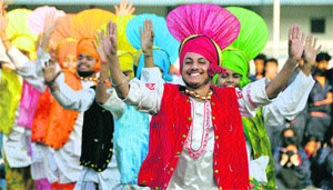 Students perform bhangra on the opening day of the 58th National School Games in Ludhiana on Tuesday.